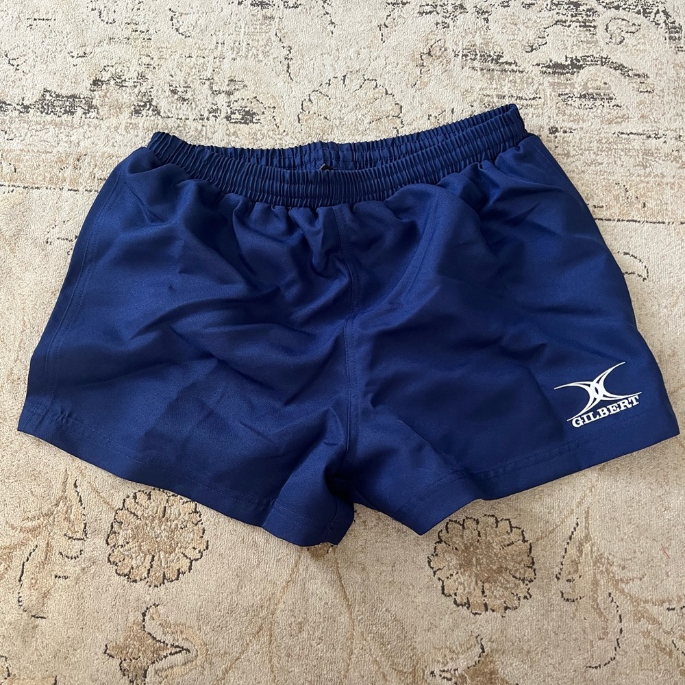 Navy blue athletic shorts.